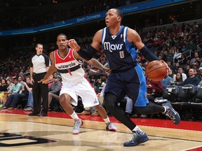 Shawn Marion #0 of the Dallas Mavericks drives against Trevor Ariza #1 of the Washington Wizards. (Ned Dishman/NBAE via Getty Images/AFP)