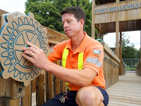 City parks worker Tim Schaly adjusts a steering wheel aboard the Lady Nicole, the pirate ship play structure in the newly-reopened West Riverside Park playground in Belleville, Ont. Tuesday, September 9, 2014. The playground is now covered in soft wood chips and has a new sandbox, sails for the ship and several other features. Luke Hendry/The Intelligencer/QMI Agency