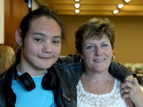 Brenda Boylan and her 16-year-old adopted son Isaiah, who is afflicted with fetal alcohol spectrum disorder. (Ian MacAlpine/The Whig-Standard)