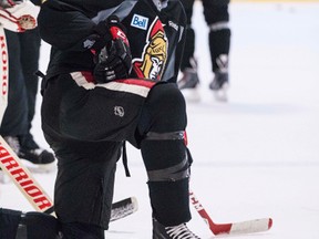 Chris Phillips takes a break during a pre-training camp skate of Ottawa Senators players at the Sensplex on Tuesday. (Errol McGihon/Ottawa Sun)