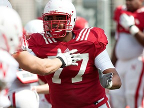 Nebraska Cornhuskers offensive linesman David Knevel blocks during practice at the Hawks Championship Center in Lincoln, Neb. (Photo by John S. Peterson)