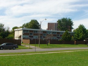 A gunshot was fired at a woman, while her kids looked on, at this Station Blvd., housing complex in Alta Vista on Monday night, Sept. 8, 2014. The woman was left shaken, but was not injured. (DANIELLE BELL Ottawa Sun)