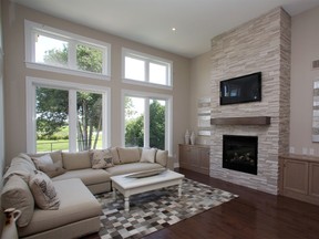 It’s easy to get a glimpse of the outdoors through the large livingroom windows in the Alexander. This model home is located in eQuinelle in Kemptivlle.