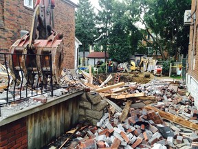 Workers clear debris from a house collapse on  Brookdale Ave. on Thursday, Sept. 10, 2014. (DAVE THOMAS/Toronto Sun)
