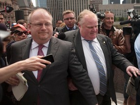 Mayor Rob Ford and his then-chief of staff Mark Towhey leave after City Hall in this May 17, 2013 file photo. (Reuters file)