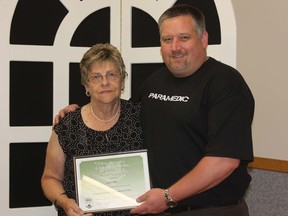 Gord Marsh, director and past president of the Forest and District Agriculture Society, recently presented long-time fair board volunteer Carol Stutt with the OAAS Agriculture Service Award.