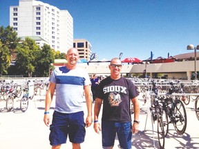 Portage la Prairie’s Dave Foley, left, and John Ferg, right, are ironmen yet again after completing an Ironman Triathlon race in Madison, Wisconsin Sept. 7.