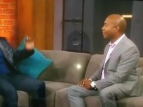 Mike Tyson, centre, appears on CP24 with host Nathan Downer Wednesday, Sept. 10, 2014. (YouTube framegrab)