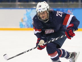 Amanda Kessel, seen here playing for Team USA at the 2014 Sochi Olympics, will miss the entire college hockey season for the University of Minnesota. (Al Charest/QMI Agency/Files)