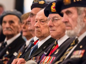 Veteran J. B LeMay, 91, of Ottawa, listens to a speech during a special ceremony to pay tribute to veterans on the 75th anniversary of Canada's engagement in the Second World War. September 10, 2014. Errol McGihon/Ottawa Sun/QMI Agency