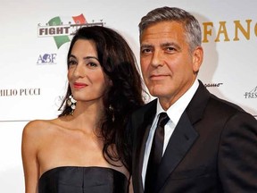 Director and actor George Clooney with his fiancee barrister Amal Alamuddin,

REUTERS/Giampiero Sposito