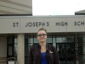 St. Joseph's Catholic High School student Jessica Alex Ford stands outside the school. Ford wrote and stars in a video that tackles the true meaning of bullying. (Ben Forrest, Times-Journal)