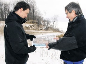 Peter Dutchak, left, deputy director of engineering services for Elgin county, and Clayton Watters, director, point out on a topographical map a severe section of erosion bordering Elgin County Road 24 (Dexter Line), two km west of Port Bruce in this 2011 picture
(File photo)