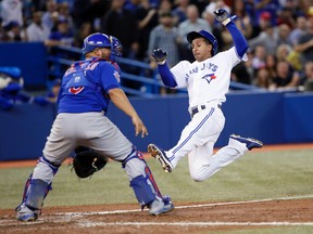 Toronto Blue Jays center fielder Anthony Gose scores against Chicago Cubs catcher Welington Castillo in the sixth inning on a hit by Toronto Blue Jays shortstop Jose Reyes at Rogers Centre. (John E. Sokolowski/USA TODAY Sports)