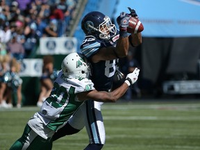 Wide receiver Spencer Watt hauls in a pass during the Argos’ romp over the Green Riders at the Rogers Centre on July 5.  (AFP)
