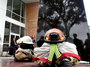 Firefighter equipment sits at the base of a monument September 11, 2014 memorializing London firefighters who have lost their lives in the line of duty. CHRIS MONTANINI\LONDONER\QMI AGENCY