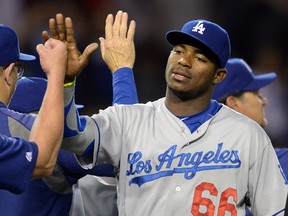 Los Angeles Dodgers center fielder Yasiel Puig (66) walks off the field after defeating the Los Angeles Angels 7-0 at Angel Stadium of Anaheim. (Jayne Kamin-Oncea-USA TODAY Sports)