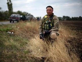 A Ukrainian serviceman stands guard near Volnovaha, Donetsk region, September 11, 2014. (REUTERS/Gleb Garanich)