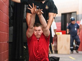 Curtis Lazar throws a medicine ball during fitness testing at the Senators rookie camp at Canadian Tire Centre on Thursday. (Errol McGihon/Ottawa Sun/QMI Agency)