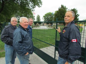 Work continues on an RCAF 403 Wing project to restore an F-86 "Golden Hawk" Sabre jet that has been displayed in Sarnia's Germain Park for many years. Several members of the restoration team, from left, Robert  Burns, Dennis Smith, Rick West and Mark Seibutis stand outside a fence set up for improvements being made in the park, around the pedestal where the jet is expected to be mounted again later this year. PAUL MORDEN/THE OBSERVER/QMI AGENCY