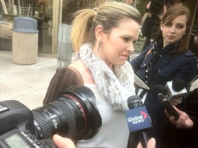 Emily Cablek speaks to reporters Thursday after her ex was sentenced to four years in jail for abducting the former couple's two children and fleeing to Mexico for four years. (DEAN PRITCHARD/WINNIPEG SUN)