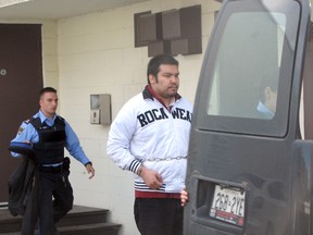 Byron Spence, who was convicted of first-degree murder in connection with the Oct. 24, 2009 shooting death of his half-brother Jonah Trapper, is seen here being led out of the Ontario Superior Court of Justice on Sept. 11, 2014. Spence is appealing the guilty verdict and has a hearing date set with the Ontario Court of Appeal on May 31.
