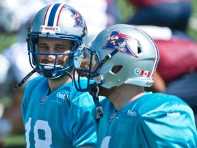 Jonathan Crompton, left, chats with teammate Tanner Marsh during Alouettes practice in August. (Martin Chevalier, QMI Agency)