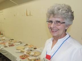 Geraldine Logan is the judge of the baked goods entries for this year's Kingston Fall Fair, getting to sample the pies, cookies, tarts and cakes behind her. THURS., SEPT 11, 2014 KINGSTON, ONT. MICHAEL LEA\THE WHIG STANDARD\QMI AGENCY