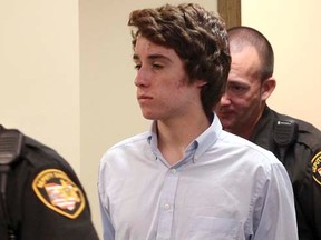 Chardon High School gunman TJ Lane (C) in court in Chardon, Ohio  May 24, 2012.  REUTERS/Aaron Josefczyk, file