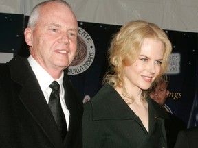 Actress Nicole Kidman is escorted by her father, Dr. Antony Kidman, as she arrives at the 2005 Palm Springs Film Festival Gala dinner in Palm Springs, California in this January 8, 2005 file photo. REUTERS/Fred Prouser/Files