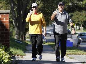 The "Blister Brothers", Wayne Dewe, left, and Bernie Ouellet are back out again this year, walking from the Quinte West, Ont. YMCA to Belleville's (above) in support of the Y's Strong Kids Campaign Friday, Sept. 12, 2014. - JEROME LESSARD/THE INTELLIGENCER/QMI AGENCY