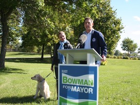 Brian Bowman brought his wife Tracy and with their miniature labradoodle Indiana to the greenspace at Provencher Boulevard and Waterfront Drive Sept. 12, 2014 to announce how he will build a neighbourhood downtown if elected mayor.