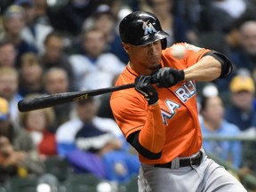 Miami Marlins right fielder Giancarlo Stanton (27) is hit by a pitch in the fifth inning and had to leave the game against the Milwaukee Brewers at Miller Park on Sep 11, 2014 in Milwaukee, WI, USA. (Benny Sieu/USA TODAY Sports)