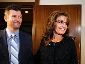 Former Republican governor of Alaska Sarah Palin and her husband Todd arrive for a celebration for evangelist Billy Graham's 95th birthday in Asheville, North Carolina November 7, 2013. (REUTERS/Chris Keane)