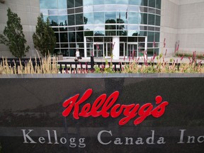 An employee enters Kellogg's prior to the start of 3:00pm shift in London, Ontario on Friday, September 12, 2014. Today is the last day of work for 60 percent of the employees at the cereal maker. The plant will close completely in December. (DEREK RUTTAN/QMI AGENCY)