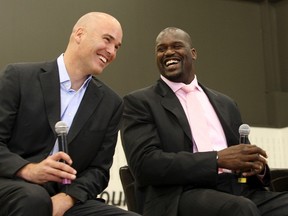 Danny Ferry (left), seen here joking with Shaquille O'Neal in 2009, has taken an indefinite leave of absence from the Hawks on Friday. (Aaron Josefczyk/Reuters/Files)