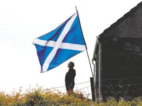 Scottish Saltire flies in the garden of a cottage on the Isle of Lewis in the outer Hebrides this week. (REUTERS)