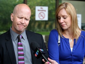Scott Allnut and his wife Melissa Brown - Allnut speak to the media outside the Law Courts, in Edmonton Alta., on Friday Sept. 12, 2014. A Feb. 8, 2013 assault at an Edmonton bar, left Scott Allnut with brain damage. David Bloom/Edmonton Sun/QMI Agency