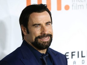 John Travolta at the premiere of The Forger at Roy Thomson Hall during the Toronto International Film Festival in Toronto on Friday September 12, 2014. Michael Peake/Toronto Sun/QMI Agency