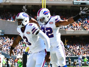 Buffalo Bills quarterback EJ Manuel (left) celebrates a touchdown against the Chicago Bears with teammate Fred Jackson at Soldier Field in Chicago, Sept. 7, 2014. (MIKE DiNOVO/USA Today)