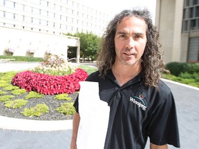 Taz Stuart, the city's former chief entomologist, leaves city hall with his nomination papers on Sat., Sept. 13, 2014. Stuart plans to run for council in River Heights-Fort Garry.