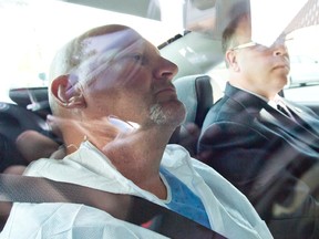 Richard Henry Bain is taken to court in Montreal, Sept. 6, 2012. (PIERRE-PAUL POULIN/QMI Agency)