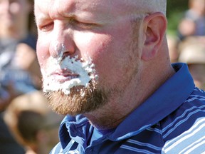 Champion School’s new principal Greg Rollingson received quite the welcome Sept. 5 during back to school events. Here, he winces after getting pied.