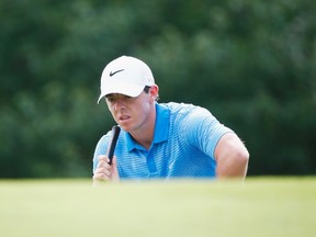 Rory McIlroy of Northern Ireland looks over the 1th green during the third round of the TOUR Championship by Coca-Cola at the East Lake Golf Club on September 13, 2014. (Sam Greenwood/Getty Images/AFP)