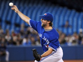 Toronto Blue Jays starting pitcher R.A. Dickey delivers a pitch against Tampa Bay Rays at Rogers Centre on Sept. 13, 2014. (DAN HAMILTON/USA TODAY Sports)