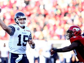 Argonauts quarterback Ricky Ray gets the pass off under pressure against the Stampeders in Calgary on Saturday night. (Darren Makowichuk/QMI Agency)