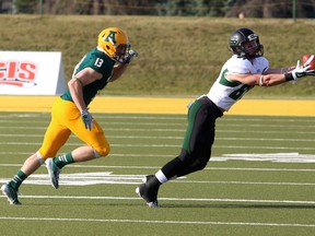 The University of Saskatchewan Huskies wide receiver Mitch Hillis stretches out for a spectacular catch during the first quarter of the University of Alberta Golden Bears home opener at Foote Field in Edmonton, AB on September 13, 2014. TREVOR ROBB/Edmonton Sun/QMI Agency
