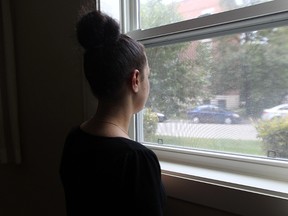 A woman who works for an escort agency in Winnipeg is photographed on Sat., Sept. 13, 2014. The agency said calls to Winnipeg police to help the escort, who was being beaten by a client, were ignored.