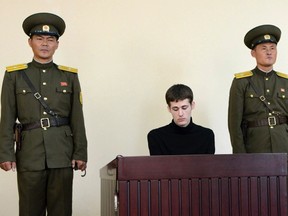 U.S. citizen Matthew Todd Miller sits in a witness box during his trial at the North Korean Supreme Court in this undated photo released by North Korea's Korean Central News Agency (KCNA) in Pyongyang September 14, 2014. North Korea sentenced Todd Miller to six years hard labour for committing "hostile acts" as a tourist to the isolated country, a statement carried by state media said on Sunday. Miller, from Bakersfield, Calif., and in his mid-20s, entered North Korea in April this year whereupon he tore up his tourist visa and demanded Pyongyang grant him asylum, according to a release from state media at the time.  REUTERS/KCNA