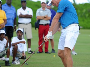 Professional Golfer Greg Norman attends the Sandals Foundation Million Dollar Hole-In-One Shootout and Golf Clinic with Greg Norman during Day Three of the Sandals Emerald Bay Celebrity Getaway And Golf Weekend on September 29, 2013 at Sandals Emerald Bay in Great Exuma, Bahamas.  Dimitrios Kambouris/Getty Images for Sandals/AFP